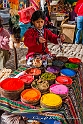 2143 Young Quechua girl selling dyes